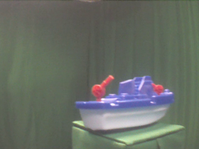 315 Degrees _ Picture 9 _ Blue and White Toy Boat.png